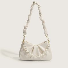 UAKISS - Niche Korean Luxury Elegant Pearl Beading Shoulder Bag Fashion Popular Pleated Design Leisure Underarm Pack Zippwer Design Bag size: 26*8*13.5(cm) Handle length: (cm) Fashion Cream Bag With Pearl Handle, Cream Bags With Pearl Handle, White Shoulder Bag With Pearl Handle For Daily Use, Daily Use White Shoulder Bag With Pearl Handle, Elegant Evening Cream Baguette Bag, Elegant Beige Pouch Baguette Bag, Beige Pouch Baguette Bag For Evening, White Handheld Baguette Bag For Evening, White Shoulder Bag With Pearl Handle