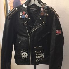 Unik Leather Jacket Motor Head Embellished With Motor Head Patches, Pins, Studs. Leather In Great Condition, Could Use A Cleaning Missing A Couple Of Studs Size 44 Punk Metal Rock Rock Style Leather Jacket With Long Sleeves, Rock Style Long Sleeve Leather Jacket, Moto Leather Jacket With Studs For Biker Events, Fall Moto Outerwear With Studs, Studded Moto Leather Jacket For Biker Events, Embellished Long Sleeve Biker Jacket For Winter, Biker Style Outerwear With Studs For Biker Events, Moto Leather Jacket With Studs For Winter, Edgy Embellished Winter Outerwear