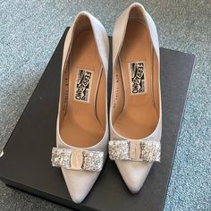 This Pair Is Maker Of Silk Materials And Almost In A Perfect Condition. I Only Wore It A Couple Of Times For Events. My Shoe Size Is Between 6&1/2 To 7. This Pair Will Fit For Us Shoe Size Between 7&1/2 To 8. I Did My Best To Show The Length (See Pic). Metallic Silver Heels With 4-inch Heel For Formal Occasions, Classic Silver Heels With 4-inch Heel, Luxury Metallic Silver Pointed Toe Heels, Classic Silver Fitted Heels, Classic Silver High Heels, Classic Fitted Silver Heels, Elegant Silver Heels With Pointed Toe, Classic Silver Low Heel Shoes, Classic Silver Low Heel Heels