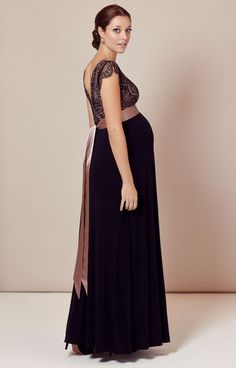 Our best selling Rosa maternity gown in Vintage Blush is the perfect party dress. So we've added a full length version for those A-list evenings when you want to shine. We've increased the opulence and accentuated the drape with an extra layer of sumptuous, soft shimmer sheer black jersey to the skirt. The bodice has a delicate scallop edged lace with a peep of dusky pink sheen. A simple crossover neckline slims and flatters, framed by the daintiest of lace capped sleeves. From a vintage rose de Simple Maternity Dress Pattern, Fitted Empire Waist Maternity Dress For Party, Fitted Floor-length Maternity Dress For Prom, Elegant Floor-length Maternity Dress For Wedding, Pink Empire Waist Maxi Dress For Evening, Elegant Pink Maternity Dress For Party, Elegant Floor-length Maxi Dress For Maternity, Elegant Pink Maxi Maternity Dress, Elegant Pink Maxi Length Maternity Dress