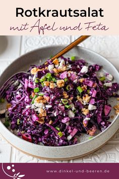 a bowl filled with purple cabbage and nuts