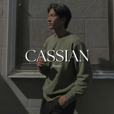 a man standing in front of a window with the word casssian on it's side