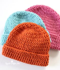 three crocheted hats sitting next to each other