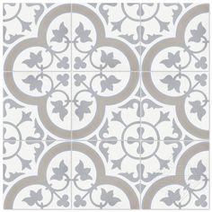 a white and grey tile with an intricate design