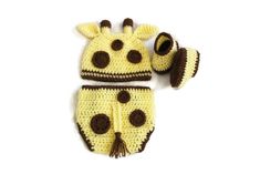 a crocheted giraffe hat and diaper cover is shown on a white background