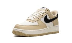 The Nike Air Force 1 Low “Team Gold” is a mostly two-tone colorway of the old school basketball sneaker.  On the “Team Gold” Air Force 1 Low, Nike decorated the popular shoe with a white canvas base and Team Gold leather overlays.  A black leather Swoosh logo can be found on the sides.  “Nike Air Force 1” branding appears on the tongue tag and a “Nike Air” logo is embroidered in white lettering on the black heel tab.  A white rubber midsole and gold rubber outsole finish off the look.  Release d Popular Shoe, Air Logo, White Air Force 1, White Air Forces, School Basketball, Nike Gold, Nike Air Force 1 07, Popular Shoes, Nike Air Force 1 Low