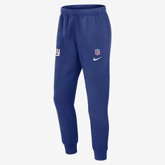 Featuring a team logo near the top, the New York Giants Sideline Team Issue Club Pants are crafted with a cozy fleece lining and soft cotton-polyester blend to help keep you warm and comfortable. Blue Fleece Bottoms For Winter, Winter Blue Fleece Bottoms, Nike Fleece Bottoms, Nike Blue Sport Bottoms, Team Spirit Bottoms For Sports Season, Team Spirit Bottoms For Sports Season Events, Blue Cotton Bottoms For Sports Events, Blue Relaxed Fit Fleece Pants, Nike Blue Fleece Bottoms