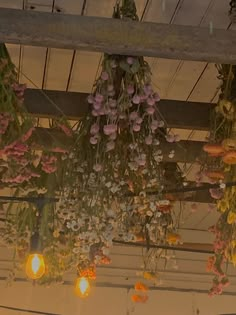 flowers hanging from the ceiling in a room