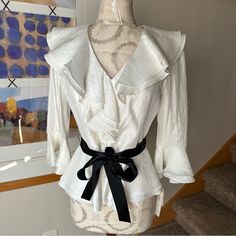 Brand: Adriana Papell Size: 6 New With Tags $110 Perfect For The Holidays Or Specials Occasion. Pair With A Skirt Or Black Pants Or A Pair Of Jeans And Some Black Heels. Color: White With A Subtle Shimmer. Black Ribbon Accent Belt. Pit To Pit: 16.5” Length: 22.5” Sleeve: 18” Any Questions, Just Ask! Elegant White Blouse For Brunch, Elegant Spring Blouse For Brunch, Elegant White Blouse For Day Out, Elegant Blouse For Spring Brunch, Chic Fitted Blouse For Day Out, Elegant V-neck Blouse For Day Out, Feminine Fitted Blouse For Brunch, Fitted Feminine Blouse For Brunch, Elegant Fitted Blouse For Day Out