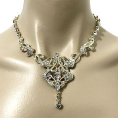 "An old hollywood glamour wedding style gold plated bridal necklace featuring Art Deco, Art Nouveau and Victorian details. This statement wedding jewelry is made of clear swarovski crystals and pearl teardrop dangle option, set on 18k gold plated base and chain. Necklace choker total length is about 16\" (40.5cm) long. Crystals part is 13\" (33cm) and chain 3\" (7.5cm) long. View all necklaces at https://etsy.me/1jokpF5" Formal Gold Crystal Backdrop Necklace, Gold Crystal Backdrop Necklace For Formal Occasions, Vintage Crystal Necklaces For Weddings, Intricate Design Gold Necklace In Crystal, Elegant Gold Rhinestone Necklace For Wedding, Elegant Gold Bridal Necklace For Evening, Gold Necklace With Intricate Crystal Design, Gold Necklaces With Intricate Crystal Design, Gold Bridal Necklace With Elegant Design For Evening