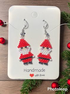 These beautiful Santa earrings will bring style to any outfit. They are Unique and Gorgeous and perfect for wearing at Christmas or any other time of the year for that matter. They are made with excellent quality Miyuki delica beads and are a size 11.0 bead.  They are sewn together using special high quality thread by myself.    If you have a question you can message me I would be happy to help Christmas Gift Jewelry With Faceted Beads, Christmas Beaded Dangle Earrings With Ear Wire, Christmas Dangle Beaded Earrings With Ear Wire, Christmas Beaded Round Earrings, Christmas Gift Beaded Drop Earrings, Handmade Beaded Earrings For Holiday Gifts, Holiday Handmade Beaded Earrings Gift, Beaded Dangle Christmas Jewelry, Handmade Beaded Earrings For Christmas