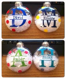 three personalized christmas ornament ornaments on a table