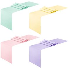 four different colors of paper on top of each other, with one folded in the middle