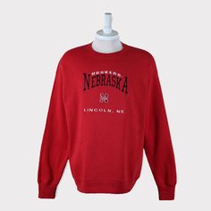 Embroidered Vintage 90s Nebraska Huskers Sweatshirt/Nebraska University/Nebraska Huskers Shirt/Huskers Tshirt/Huskers T shirt/Sweater/Hoodie 💯 SATISFACTION AND AUTHENTICITY ⭐ MEASUREMENTS (when laid flat) Size on Tag: L Length: 74cm or 29 inches Armpit to armpit: 60cm or 24 inches ⭐ CONDITION 9/10 (Very good) Details: No holes Material: Cotton Color: Red Brand: Lee Sport 🔷 Please give us your phone no. together with address after you purchased. 🔷Please keep in mind that our items are vintage Huskers Football, Husker Football, Football Sweater, Nebraska Huskers, College Fits, Nebraska Cornhuskers, Football And Basketball, Spirit Wear, School Fits