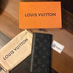 This Is A Mens Long Wallet Lv Original! Brand New Comes With Box And Dust Bag. Never Used! It Does Have Initials Ecg. But Like I Said Never Used Brand New. Louis Vuitton Wallet Mens, Luxury Black Wallets For Daily Use, Luxury Black Wallet With Logo, Luxury Wallet In Monogram Canvas, Designer Monogram Canvas Wallets For Business, Designer Business Wallets With Logo, Designer Business Wallet With Logo, Black Monogram Canvas Wallet For Everyday Use, Black Monogram Canvas Wallet