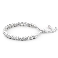 Create a sensation with this fashion-forward tennis bracelet. This graceful look features a fluid line of sparkling round stones. This classic, elegant and timeless look blends sophistication with radiance and sparkle. Crafted in high-polished sterling silver, this bracelet is sure to add a touch of elegance and style to any outfit, from business casual to formal wear.Carat Weight: 7.585 ctStone Size: 4,1.1 mmNumber of Stones: 43 Stone Shape: RoundStone Color: Diamond WhiteWeight: 11.94 gWidth: Bracelet Online, Classic Elegant, Tennis Bracelet, Quality Jewelry, Formal Wear, Business Casual, Round Cut, Natural Gemstones, Necklace Lengths