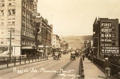 an old black and white photo of a city street