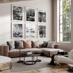 a living room filled with furniture and pictures on the wall