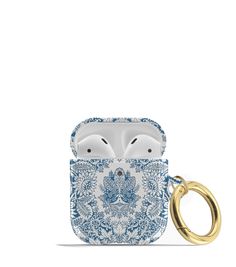 an apple airpods case with a blue and white floral pattern on the front, featuring two gold rings