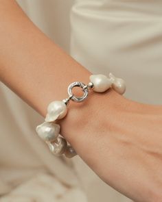 BAROQUE PEARL | Fitted with a 9k white gold O-ring clasp, this freshwater baroque pearl bracelet is a unique statement piece with its irregularly shaped pearls. Each pearl is strung and double-knotted using fine silk thread for durability and strength.⁠ ⁠ The Pearl, Silk Thread, Precious Gemstones, Baroque Pearls, O Ring, Pearl Bracelet, Semi Precious Gemstones, Statement Pieces, Semi Precious