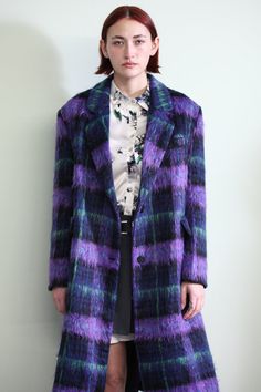 Step into elegance with our enchanting Wool Purple Plaid Coat. This purple-toned coat is carefully curated with a captivating interplay of dark and light shades, accented by a hint of refreshing mint green. This single-breasted coat exudes a distinctive charm, coupled with two side flap pockets and a classic lapel. Stay cozy and stylish throughout the year with our Heavy Wool Plaid, perfect for any season's cool and chilly weather. Composition: 100% Wool Heavyweight fabric Tailored for a relaxed Tartan Coat Outfit, Purple Long Coat, Wool Coat Outfits, Colorful Plaid Coat, Short Coat Outfit, Retro Purple Winter Outerwear, Dark Purple Winter Coat, Plaid Purple Coat, Plaid Peacoat