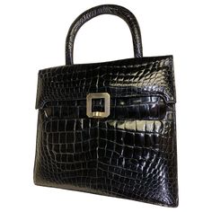 1960s Genuine black center-belly alligator skin handbag: Tailored, accordian-pleated and structured with a padded handle, front flap closure and brushed silver-tone buckle. Medium sized. Excellent condition. Black Alligator, Alligator Skin, Top Handle Handbags, Hermes Birkin, Travel Luggage, Fashion Handbags, Alligator, Travel Bag, Travel Bags