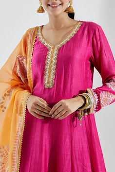 Rani pink anarkali set comes with gota pati neck and gota detailing. Paired with cotton silk block printed palazzo, co-ordinated with gota kingri lace. Comes with contrast orange foil printed kotta dupatta with gota kingri lace finish.
Component: 3
Print
Neckline: V-Neck
Sleeve Length: Full
Fabric: Cotton Silk
Color: Pink, Orange
Cutwork dupatta and palazzo hem - Aza Fashions Pink Anarkali, Printed Anarkali, Rani Pink, Palazzo Set, Luxury Sale, Silk Embroidery, Cut Work, Foil Print, Set For Women