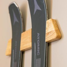 two skis are hanging on the wall next to each other