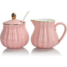 two pink vases with gold trim on the top and bottom one has a spoon in it