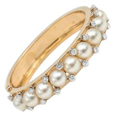 This stunning bracelet is beautiful showcasing a multitude of salt water pearls and twenty diamonds. The diamonds are VS/VS2 G/H set in 14k yellow gold and is very substantial. Pearl Bangles, Pearl Bangle Bracelet, The Bling Ring, Diamond Bangles, Rose Gold Bangle, Pearl Bangle, Vintage Bangles, Diamond Bangles Bracelet, Diamond Jewelry Designs