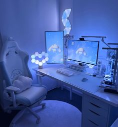 two computer monitors sitting on top of a desk next to a keyboard and monitor screen