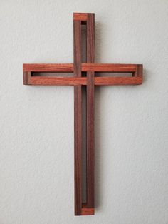 a wooden cross hanging on the wall