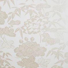 a white and gold wallpaper with flowers on it