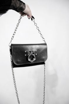 Kajan leather bag is a gothic style shoulder/crossbody/belt accessory by Madelephantshop. - Thick genuine leather - 3 cm - Two magnet clasps - 100 cm chain handle - Detachable big chain - Mirror stainless steel bat (made by MadElephant) with detachable O-ring detail Size: 21 x 14 x 4 cm (8.3 х 5.5 х 2 inches) Adjustable belt for waist 60 - 95 cm / 23.6 - 37.4 inches (please write us if u need the other size) You can use Kajan leather bag as a clutch, waist bag or as a shoulder or crossbody bag. Cheap Black Flap Bag With Detachable Strap, Bat Pendant, Ring Der O, Goth Aesthetic, Belt Accessories, Gothic Style, Adjustable Belt, Waist Bag, Leather Purse