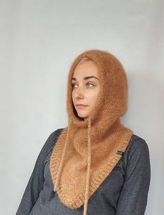 Warm Knitted Women Alpaca Hood This hood is ready to ship within 1-2 business days The hood will replace a whole set of accessories for you: a hat, a snood, a scarf, a neck warmer ... that is all in one. It will definitely not ruin your hairstyle and is very comfortable.  In a car or a store, you just take it off your head and wear it like a simple hood. One Size Fits Most Made with high quality mixed yarn: Alpaca+Mohair+merino wool+polyacryl.  Soft and light, skin friendly. Color: beige melange !! Colors may appear different on your monitor depending on your settings !! To order in another color: https://www.etsy.com/listing/1298452240/warm-knitted-women-hood-alpaca-hood?ref=listings_manager_grid Other Scarfs/Snoods: https://www.etsy.com/shop/BeTaKnitWear?section_id=25093929 Washing instr One Size Hooded Balaclava For Fall, One Size Fall Balaclava With Hood, Winter Hooded Balaclava One Size, Warm One-size Hooded Balaclava, Winter Hooded Balaclava One Size Fits Most, One Size Hooded Hats, Cozy Hooded Balaclava For Winter, Hooded Warm Winter Bonnet, Warm Hooded Winter Bonnet