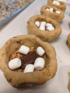 several cookies with marshmallows in the middle