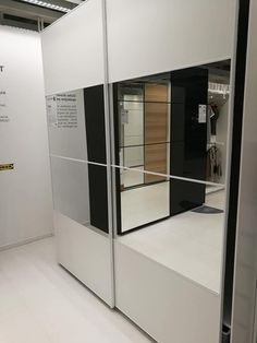 a white room with some black and white items on the wall next to each other