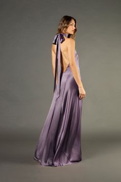 Pure silk charmeuse backless halter gown cut on the bias. Featuring a low open back and long ties at neck that can be double knotted or tied in a bow. Fully lined in silk. Made in USA. *Special orders in custom colors are available. Please email us at shop@michellemason.com for further inquiries. Composition: 100% silk Backless Gown, Halter Gown, Guest Attire, Wedding Attire Guest, Silk Charmeuse, New Arrival Dress, Knit Skirt, Tie Neck, Dream Dress