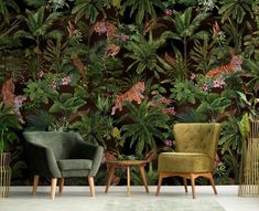 two chairs and a table in front of a jungle wallpaper