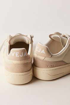 Donning a chunkier court silhouette, these low-top sneakers from Veja featured Organic Traced leather uppers complete with a perforated toe box and Amazonian rubber outsole. **Features:** Low-top style, Organic Traced leather uppers, padded collar, perforated toe box, Amazonian rubber outsole, recycled lining, lace-up closure **Why We | Veja V-90 Sneakers at Free People in Tan, Size: EU 37 Brown Tennis Shoes, Brown Tennis, Shoes Veja, Street Beat, Neutral Shoes, Vegan Shoes, Shoe Obsession, Winter 2024, Shoes Trainers