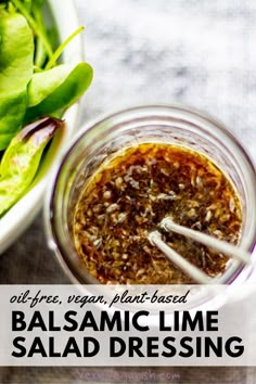 balsamic lime salad dressing in a mason jar with spinach leaves on the side