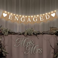 a sign that says engaged and mr and mrs