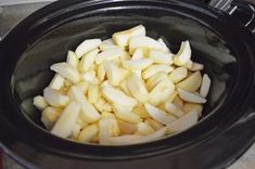 sliced apples in a slow cooker ready to be put into the crock pot