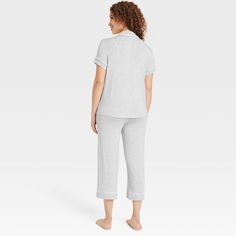 Add cool and comfy style to your everyday sleepwear collection with these Cloud-Knit Short-Sleeve Notch Collar Top and Cropped Pants Pajama Set from Auden™. Made from soft, stretchy fabric for a comfortable fit, this set includes a short-sleeve notch collar button-down top and cropped pants for a complete look. Plus, drawcord elastic waistband on the pants offers an adjustable fit. Wear the pieces as a set or mix and match with other PJs to put together a variety of sleepwear outfits. Auden™: Co Cozy Sleepwear For Loungewear, Comfy Stretch Solid Color Sleepwear, Comfortable Cotton Solid Color Sleepwear, Comfortable Solid Color Cotton Sleepwear, Comfortable Cotton Sleepwear, Comfortable Tops For Loungewear, Relaxed Stretch Sleepwear For Loungewear, Comfy Stretch Sleepwear, Casual Solid Color Sleepwear For Loungewear