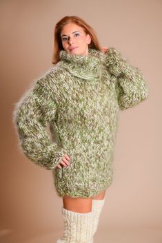 "SUPER THICK Brand new Cozy soft mohair sweater. Knitted in green and beige melange. 100 % hand knitted Ideal outfit - super warm and trendy. You can wear it as an overcoat. Huge turtleneck that will keep you warm and cozy. Materials : 6 - strands Soft premium quality longhair mohair. Color : Green/ Beige Measurements : Body length: 29,5\" / 75 cm Chest width: 21 - 24'' / 52 - 60 cm fits sizes L XL STRETCHABLE Knit Sleeve measured from the neckline to the end of the cuff: 31 \" / 78 cm Neck unro Green Mohair Winter Sweater, Green Mohair Knitted Sweater, Green Mohair Cozy Sweater, Cozy Green Mohair Sweater, Oversized Green Turtleneck Sweater, Oversized Mohair Turtleneck Sweater, Jumper Men, Pull Mohair, Chunky Turtleneck