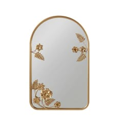 a mirror with gold flowers and leaves on the bottom, in front of a white background