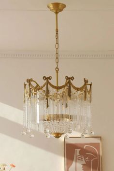 a chandelier hanging from the ceiling in a room