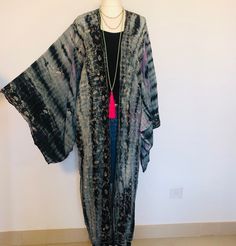 "A Beautiful Kimono Jacket,Robe . Long embroidered,silk,tie dyed and floaty ; A Perfect Cover Up for Holidays ,Festivals and Parties.  This has been Handmade and Hand Dyed from a Vintage Indian Sari.... so is completely Unique and Sustainable. A Wonderfully Chic and Flattering Grey,Lavender and Black Design in Silk ,Embellished all over with swirls of Sparkling Silver Lurex Embroidery . The style is loose and edge to edge , with Gorgeous Square Kimono Sleeves. One Size S M L   UK size 10 to 16     US 6 to 12      European 38 to 44, The length is 128 cm / 50 \". The chest is 97 cm / 38 \". This Beautiful unique jacket will soon become your Favourite Go To in your wardrobe . Timeless Boho Chic ! To see more unique designs like this please visit my Etsy Boutique at: https://www.etsy.com/shop/ Bohemian Outerwear With Natural Dye For Spring, Spring Bohemian Outerwear With Natural Dye, Fitted Bohemian Kimono For Festivals, Festival Kimono In Free Size With Long Sleeves, Festival Kimono With Long Sleeves, Free Size, One Size Long Sleeve Kimono For Festival, Long Sleeve Free Size Kimono For Festival, Fitted Silk Bohemian Outerwear, Bohemian Hand Dyed Kimono For Spring