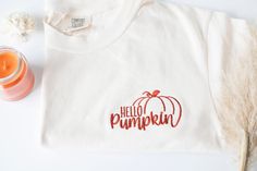 "Embroidered  Hello Pumpkin Comfort Colors T-shirt This soft and high quality comfort colors pumpkin embroidered t-shirt is going to be your new favorite fall t-shirt! Features Brand: Comfort Colors Color: Ivory 6.1 oz., 100% ringspun cotton Preshrunk, soft-washed, garment-dyed fabric 1\" ribbed collar with double-needle topstitched neckline Double-needle stitched sleeves and bottom hem Twill taped shoulder-to-shoulder Set-in sleeves 🌺 Design size 4'', placed on the left chest area 🌺 Thread co Cute Fall Shirts, Fall Shirts For Women, Fall Tee Shirts, Hello Pumpkin, Screen Color, Fall Tee, Thread Colors, Dark Orange, Trendy Fall