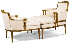 a set of three chairs with white upholstered back and arm rests on each side